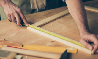 Nail Bed Injury - Man working on a workbench in a workshop